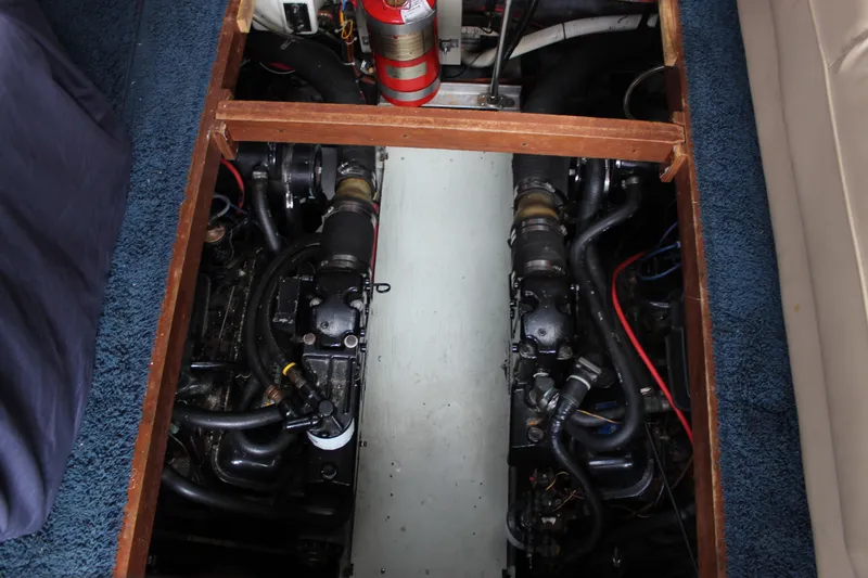 Slide: The Image of Engine compartment of 1987 Carver 36 Aft Cabin Motor Yacht, featuring dual engines. - 31