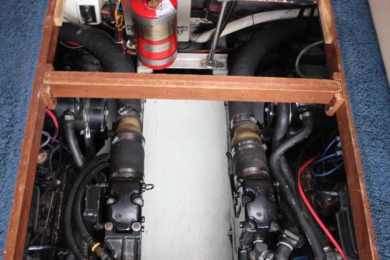 Slide: The Image of Engine compartment of 1987 Carver 36 Aft Cabin Motor Yacht, showing mechanical components. - 32