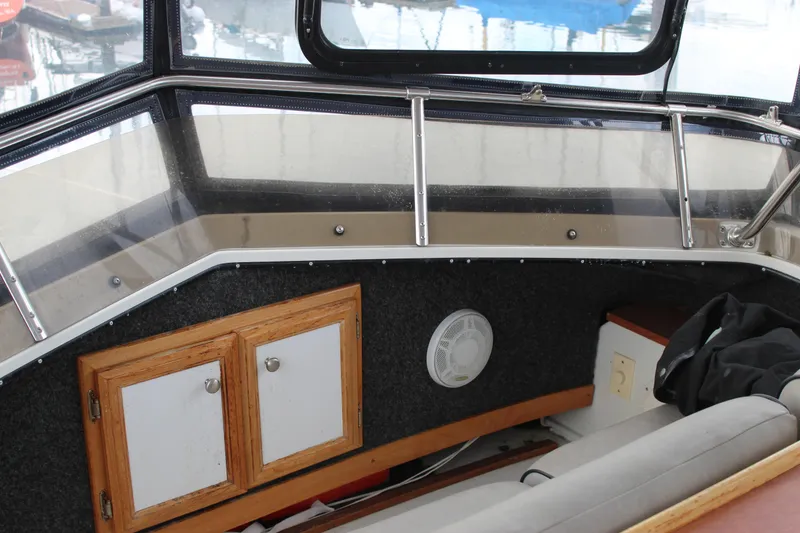 Slide: The Image of Interior of 1987 Carver 36 Aft Cabin Motor Yacht with wood cabinets and seating. - 7