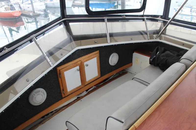 Slide: The Image of 1987 Carver 36 Aft Cabin Motor Yacht interior with seating and storage cabinets. - 13