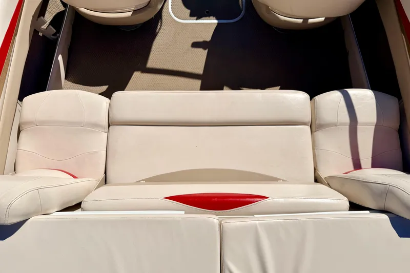 Slide: The Image of 2003 Glastron/Carlson GX180 boat interior with beige and red seating. - 20