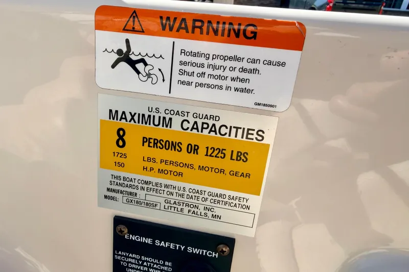 Slide: The Image of 2003 Glastron/Carlson GX180 boat capacity warning label, maximum 8 persons or 1225 lbs. - 35