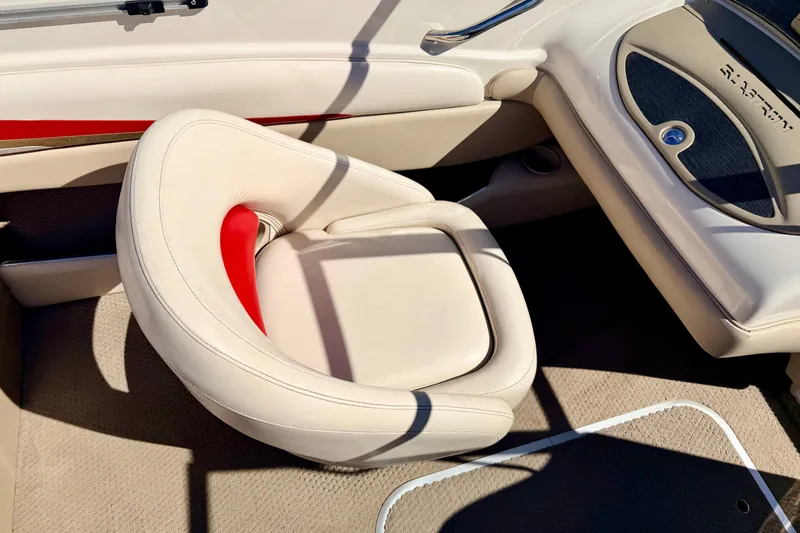 Slide: The Image of 2003 Glastron/Carlson GX180 boat interior with beige and red seating. - 38