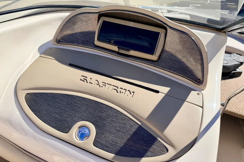 Slide: The Image of Dashboard of 2003 Glastron/Carlson GX180 boat with integrated display and logo. - 39