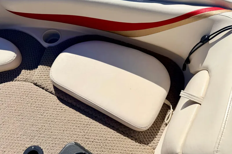Slide: The Image of 2003 Glastron/Carlson GX180 boat interior with beige seating and red accent. - 44