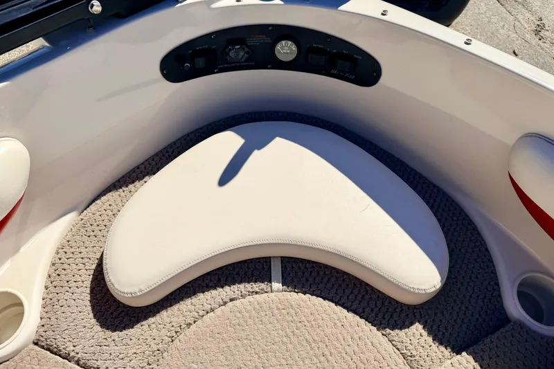 Slide: The Image of 2003 Glastron/Carlson GX180 boat interior with cushioned seating and control panel. - 45