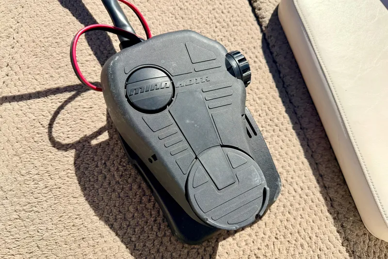 Slide: The Image of Minn Kota trolling motor foot pedal on 2003 Glastron/Carlson GX180 boat carpet. - 48