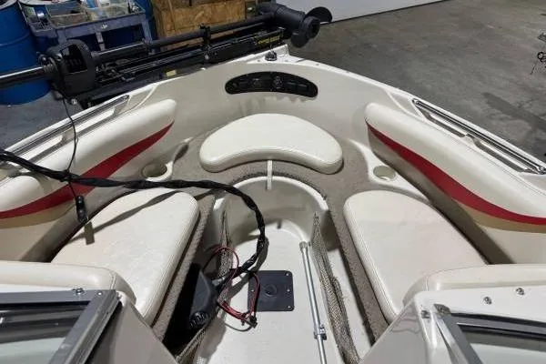 Slide: The Image of 2003 Glastron/Carlson GX180 trailer tire with red fender on asphalt. - 9