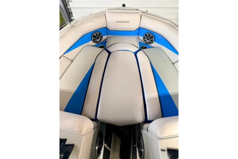 Slide: The Image of 2012 Moomba Mojo 2.5 boat interior with blue and white seating. - 15