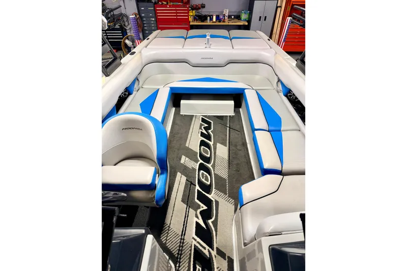 Slide: The Image of 2012 Moomba Mojo 2.5 boat storage compartment with blue and white interior accents. - 16