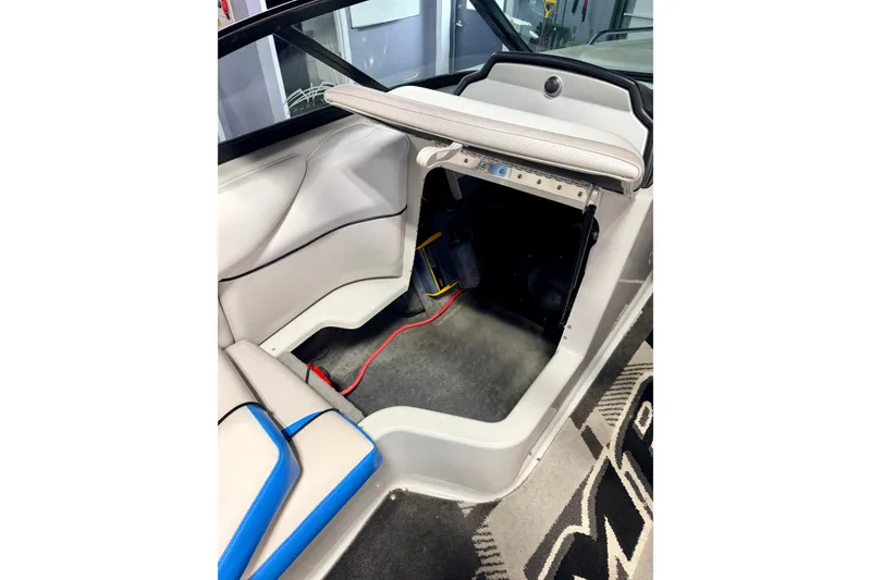 Slide: The Image of Open storage compartment of 2012 Moomba Mojo 2.5 boat, showing interior details. - 25