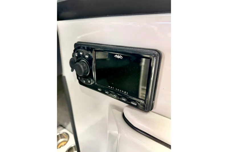 Slide: The Image of Control panel of a 2012 Moomba Mojo 2.5 boat with various switches. - 27