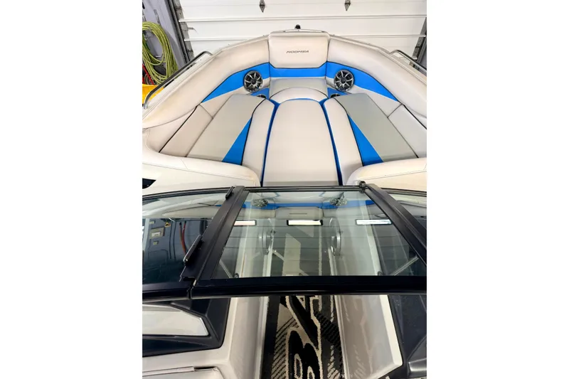 Slide: The Image of 2012 Moomba Mojo 2.5 boat interior with blue and gray seating. - 31