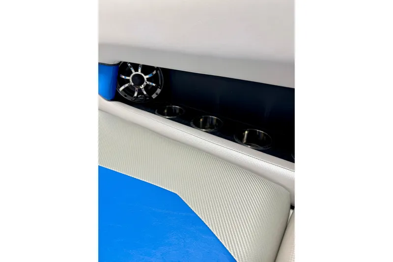 Slide: The Image of 2012 Moomba Mojo 2.5 boat interior with blue and gray seating and cup holders. - 32