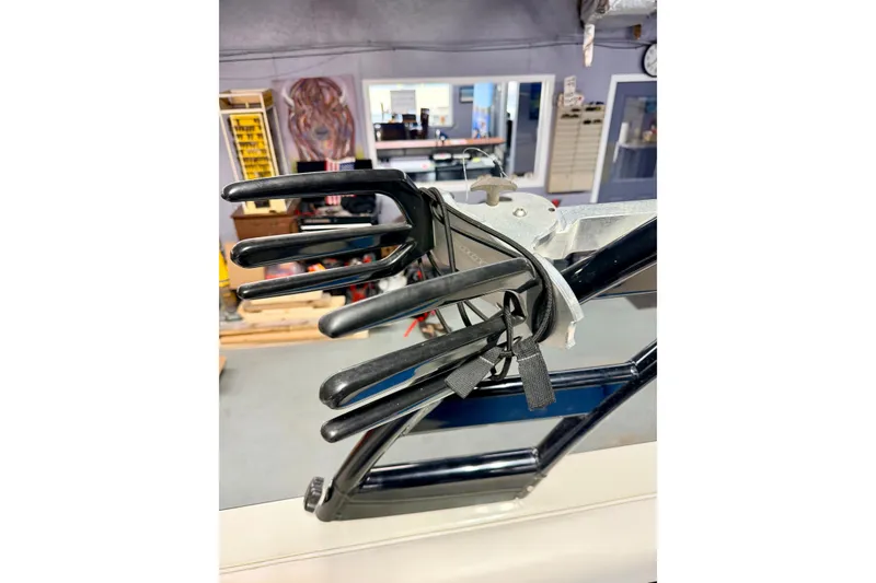 Slide: The Image of 2012 Moomba Mojo 2.5 boat interior with cup holders and blue-white seating. - 33