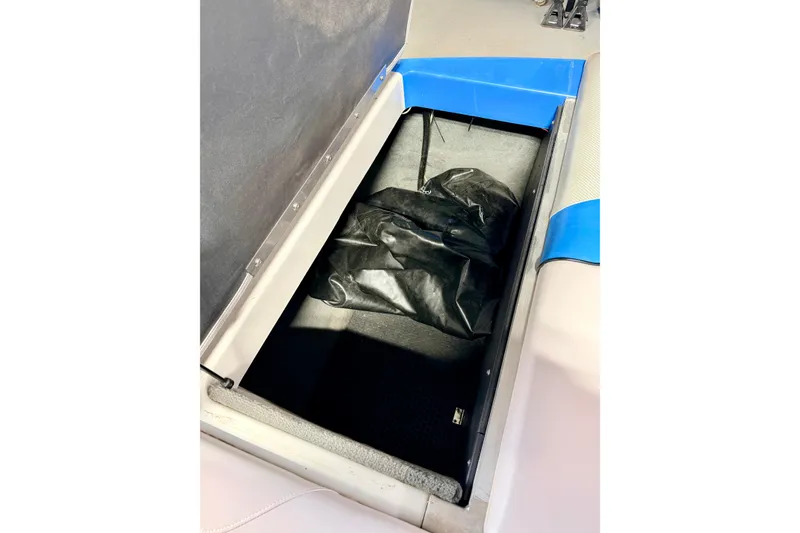 Slide: The Image of Interior storage compartment of a 2012 Moomba Mojo 2.5 boat with visible wiring. - 35