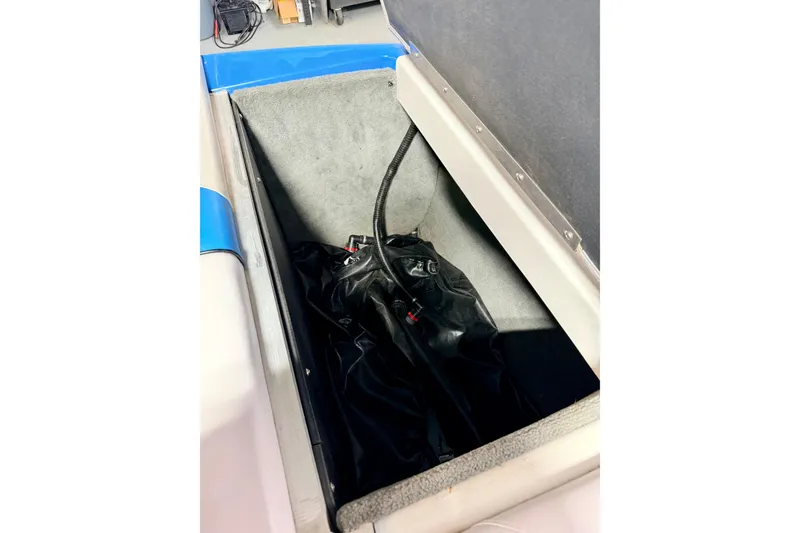 Slide: The Image of 2012 Moomba Mojo 2.5 interior with blue accents, speakers, and cup holders. - 36