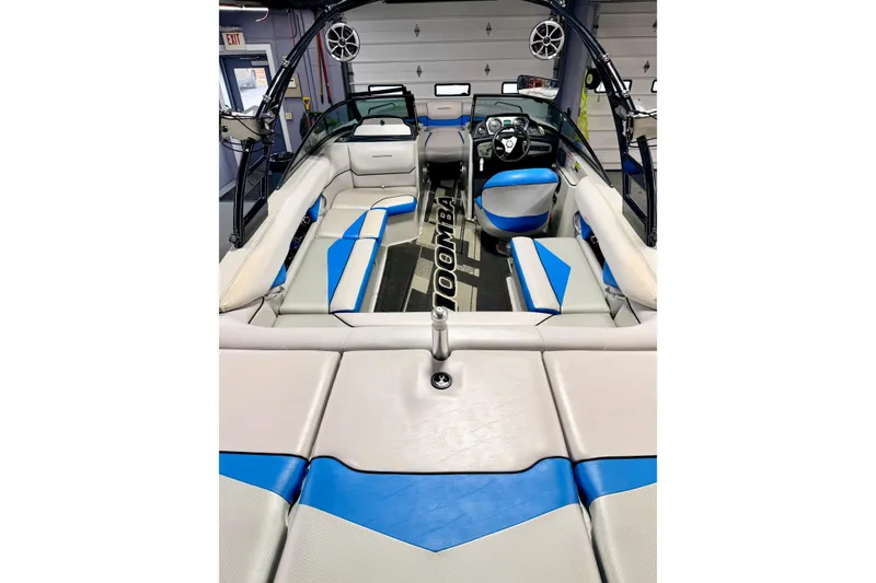 Slide: The Image of 2012 Moomba Mojo 2.5 boat interior with blue and white captain's seat and steering wheel. - 39