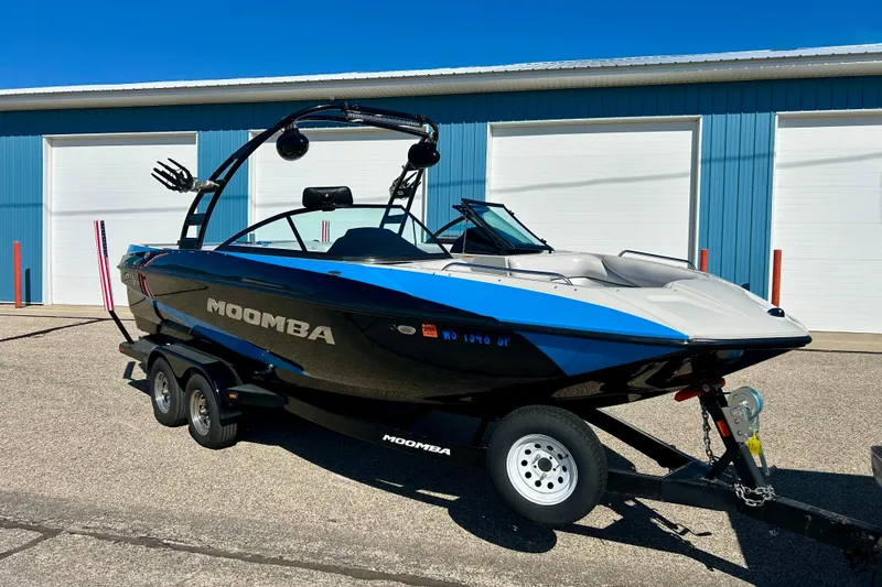 Slide: The Image of 2012 Moomba Mojo 2.5 trailer wheel on pavement, showcasing tire and rim details. - 41