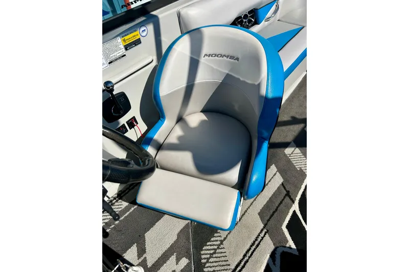 Slide: The Image of 2012 Moomba Mojo 2.5 boat interior with blue and white seating. - 50