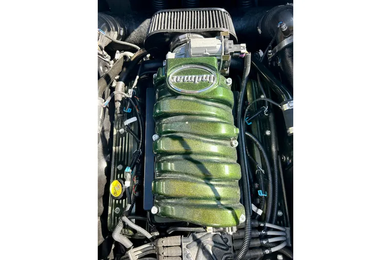 Slide: The Image of 2012 Moomba Mojo 2.5 boat interior with blue and gray captain's seat. - 52