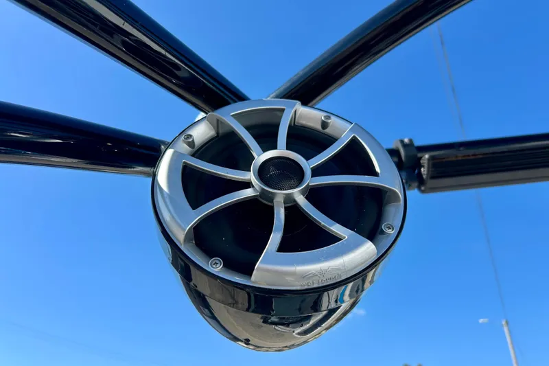 Slide: The Image of Close-up of a 2012 Moomba Mojo 2.5 boat speaker against a clear blue sky. - 55