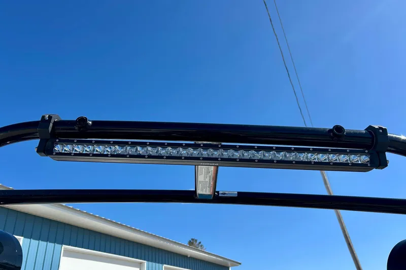 Slide: The Image of Close-up of a 2012 Moomba Mojo 2.5 boat speaker against a clear blue sky. - 56