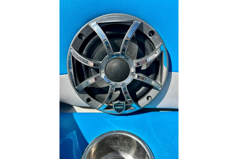 Slide: The Image of 2012 Moomba Mojo 2.5 boat interior with dual speakers and patterned carpet. - 63