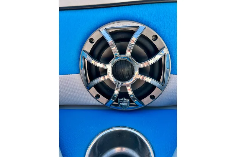 Slide: The Image of Close-up of a 2012 Moomba Mojo 2.5 boat speaker with chrome grille. - 64