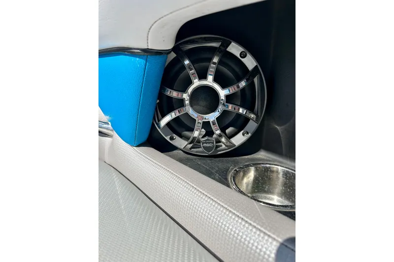 Slide: The Image of Speaker in 2012 Moomba Mojo 2.5 boat interior, featuring blue and gray upholstery. - 68