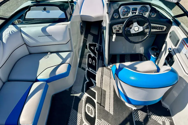 Slide: The Image of 2012 Moomba Mojo 2.5 boat interior with speaker and blue upholstery detail. - 69
