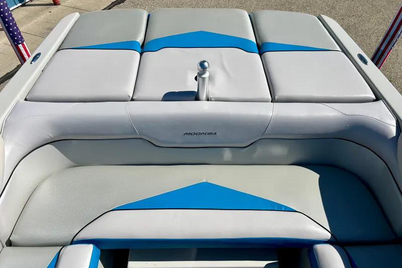 Slide: The Image of 2012 Moomba Mojo 2.5 boat interior with blue and white seating, steering wheel, and dashboard. - 70
