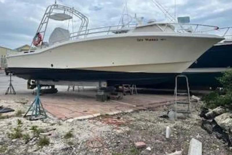 The Image of 2019 OceanPro 35 boat on dry dock, ready for maintenance under cloudy skies. - 0