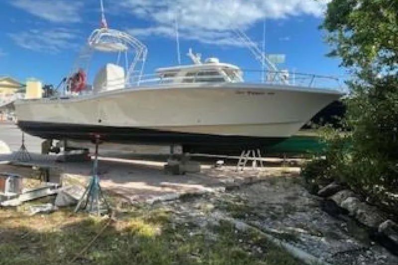 Slide: The Image of 2019 OceanPro 35 boat on dry dock under a clear blue sky. - 13