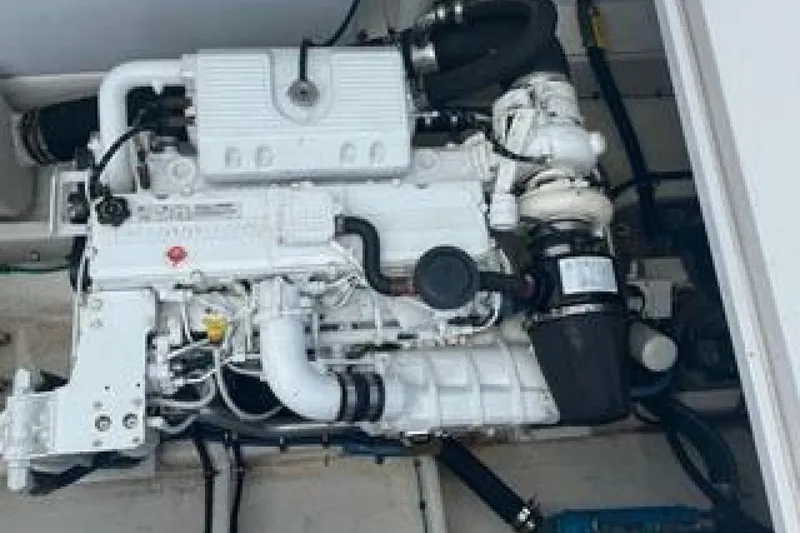 Slide: The Image of Engine of a 2019 OceanPro 35 boat, showcasing intricate mechanical components. - 5
