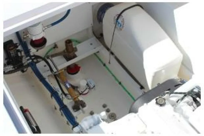 Slide: The Image of Engine compartment of 2019 OceanPro 35 boat, showcasing mechanical components and wiring. - 8