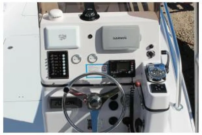Slide: The Image of Control panel of 2019 OceanPro 35 boat with steering wheel and navigation equipment. - 9