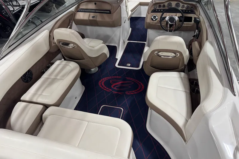 Slide: The Image of Interior of a 2012 Cobalt 242 boat with luxurious seating and elegant dashboard. - 5