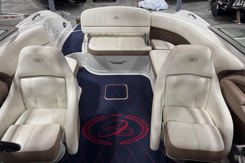 Slide: The Image of Luxurious interior of a 2012 Cobalt 242 boat with plush seating and elegant design. - 9