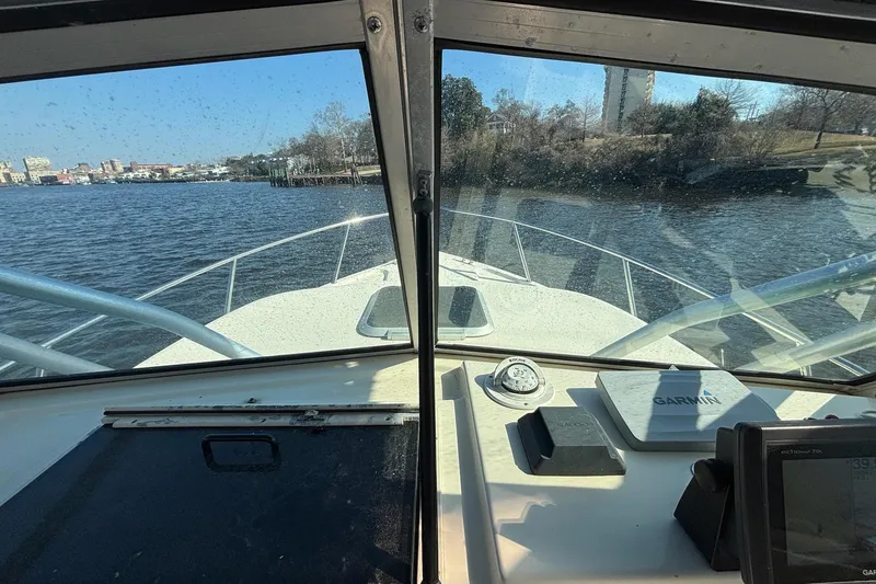 Slide: The Image of Interior view from a 1996 Parker 2110 boat, showing the dashboard and waterway. - 14