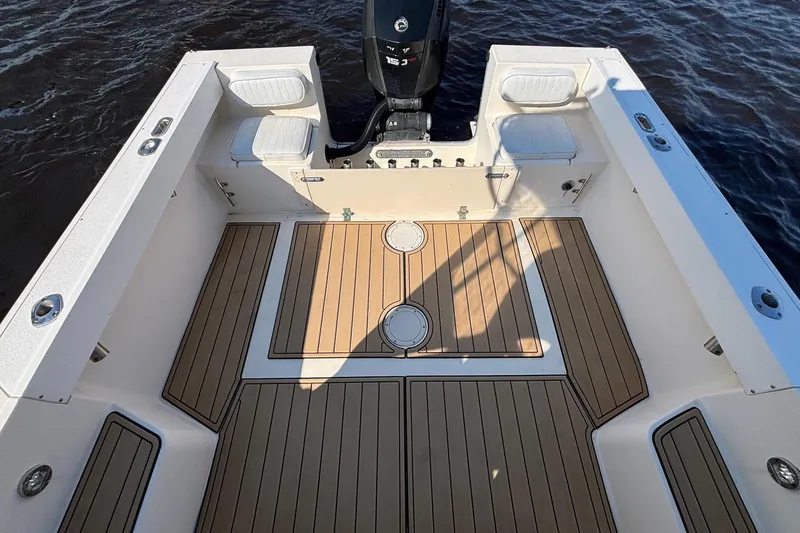 Slide: The Image of Interior of a 1996 Parker 2110 boat with wooden flooring. - 16