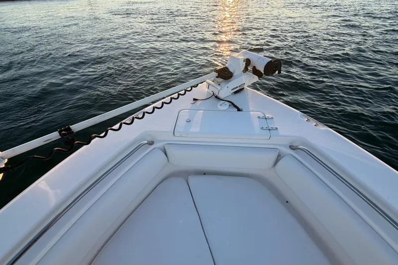 Slide: The Image of Bow of 2014 Sea Hunt Ultra 211 boat with trolling motor on calm water. - 36