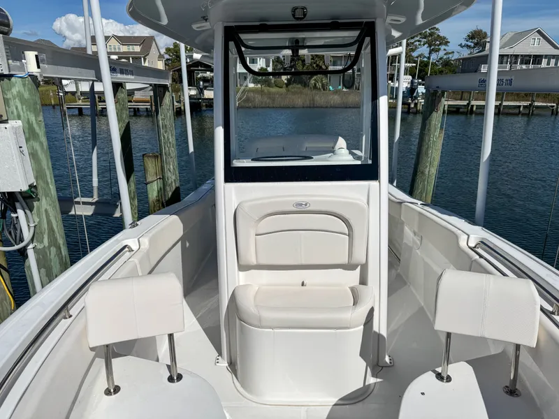 Slide: The Image of 2023 Sea Hunt Ultra 239 SE boat at dock. - 14