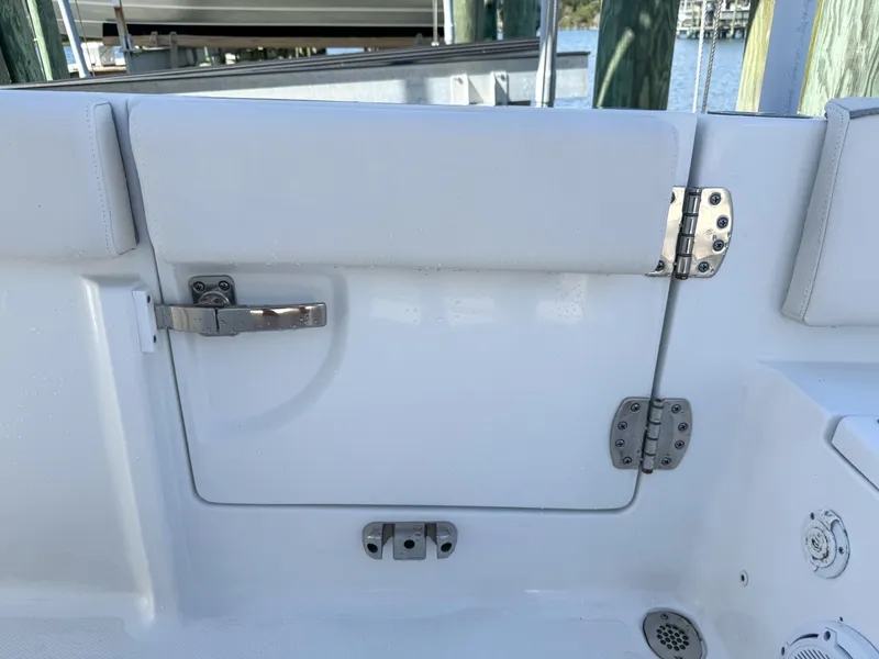 Slide: The Image of 2023 Sea Hunt Ultra 239 SE boat door with stainless steel fittings. - 29