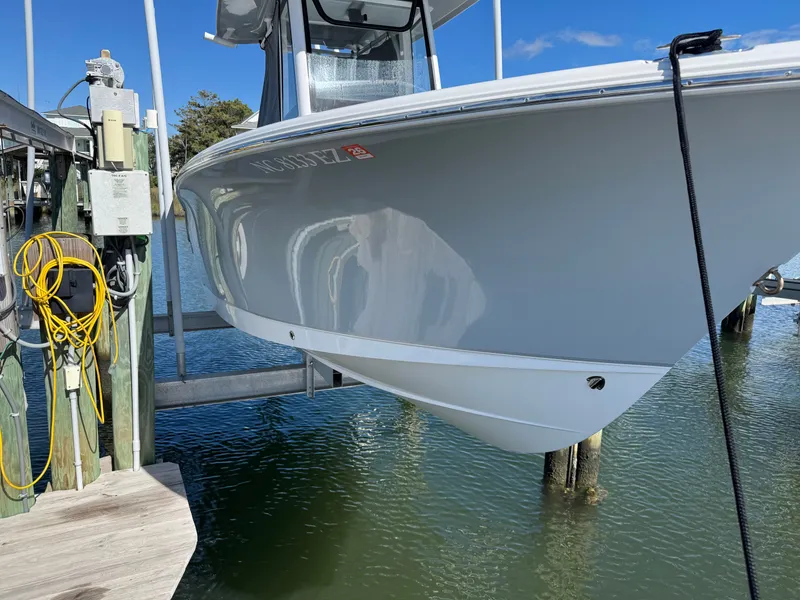 Slide: The Image of 2023 Sea Hunt Ultra 239 SE boat at dock. - 4