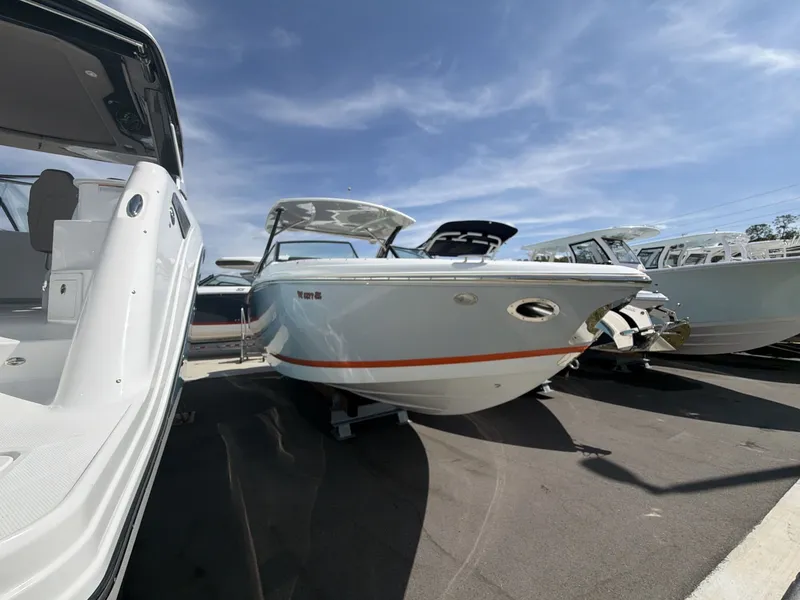 Slide: The Image of Cobalt 30SC 2021 boat on a parking lot under sunny skies. - 10