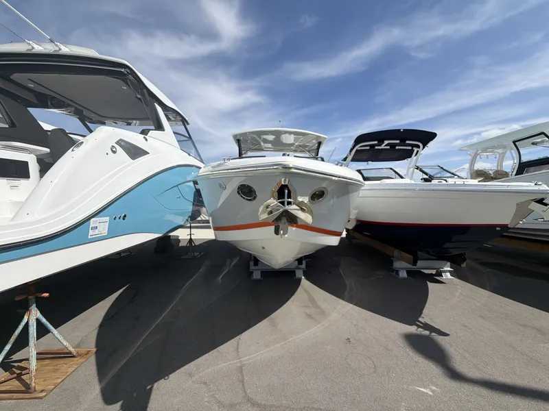 Slide: The Image of Cobalt 30SC 2021 boat on a parking lot under sunny skies. - 11