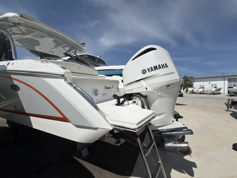 Slide: The Image of Cobalt 30SC 2021 with Yamaha outboard motor in a parking lot. - 12