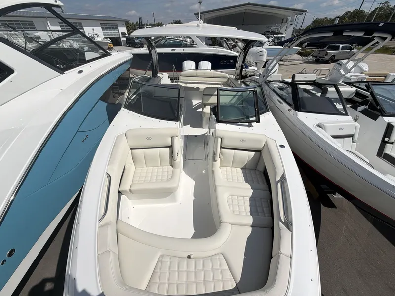 Slide: The Image of 2021 Cobalt 30SC boat with luxurious interior at the marina. - 16