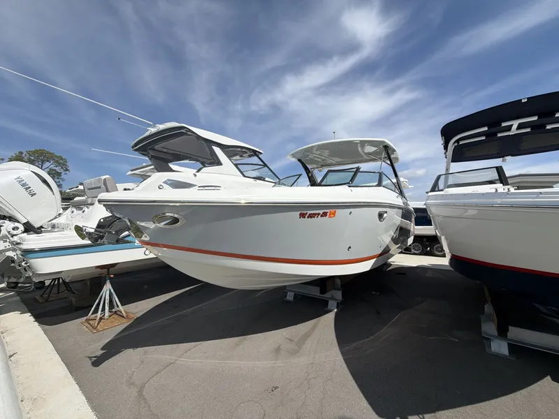 Slide: The Image of 2021 Cobalt 30SC boat on a lot under sunny skies. - 3